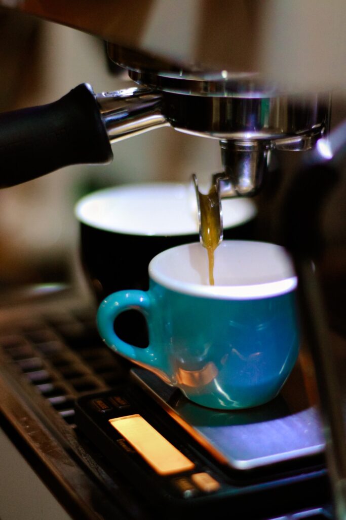 Image of espresso coffee maker with a blue cup